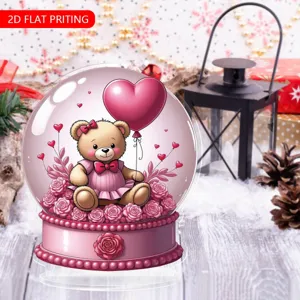 Cute 2D acrylic teddy bear snow globe ornament with heart balloon, perfect desktop decor.