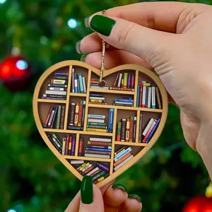 Detailed close-up view of the heart-shaped miniature bookshelf ornament with hanging gold chain.