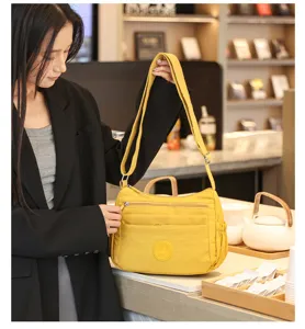 Yellow oxford cloth multi-pocket crossbody bag detail, large capacity casual shoulder bag.
