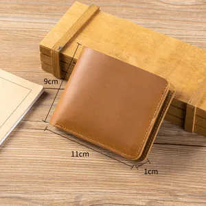 Detail view of the brown crazy horse leather short wallet, showcasing fine stitching and texture.