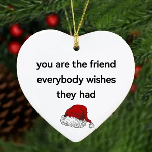 Christmas white heart shaped ceramic ornament with quote print and hanging gold string for tree.