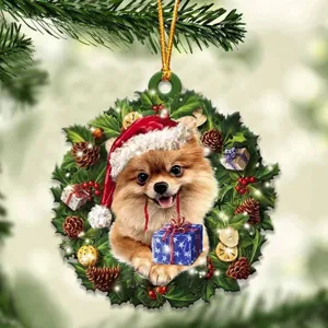 Christmas acrylic wreath ornament detail showing cute puppy wearing santa hat with gift.