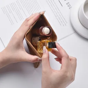 Mini leather cosmetic bag for women, portable lipstick and coin pouch storage organizer.
