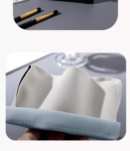 Portable mini cosmetic pouch with automatic squeeze closure, blue PU leather and velvet lining.