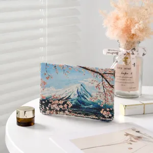 Portable cosmetic bag with scenic Mount Fuji and cherry blossom print for daily travel use.