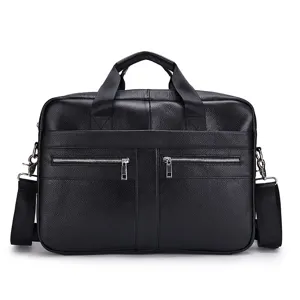 Vista dettagliata della borsa da lavoro in pelle nera con cerniere resistenti e manici robusti.