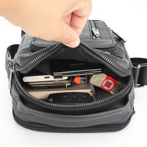 Detailed view showing multi-compartment interior capacity and quality zipper of the leather bag.
