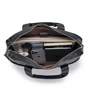 Detailed view of black leather business briefcase interior showcasing large capacity storage space.
