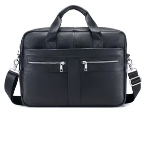 Detail view of black genuine leather business briefcase with dual handles and zip pockets.