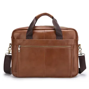 Detailed view of the brown leather business briefcase featuring durable double handles and zippers.