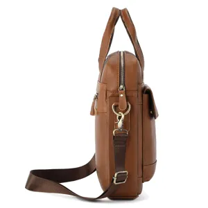 Side detail view of brown leather men's shoulder bag showing durable handle and metal hardware.