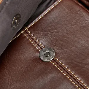 Close-up detail of men's leather business bag, showing fine stitching and metal snap button.