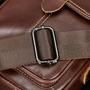 Genuine leather men messenger bag detail shot, top layer cowhide cross body bag strap buckle.