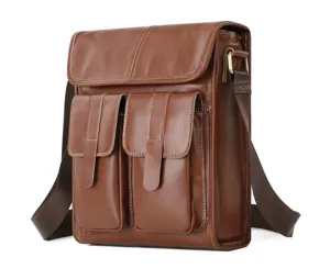 Detail view of vintage brown leather messenger bag, casual cowhide crossbody shoulder bag.