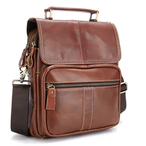 Detailed view of brown genuine leather men messenger bag with vintage style and durable handle.