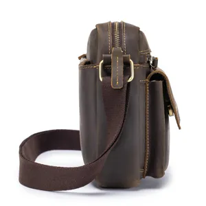 Side detail of retro brown crazy horse leather men shoulder bag with metal hardware and strap.