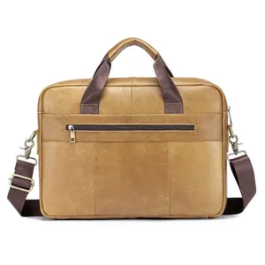 Detail view of the brown leather business briefcase showing zipper pocket and hardware.
