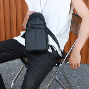 Men genuine leather chest bag detail view, black crossbody sling bag for daily commute.