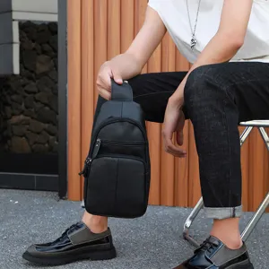 Detail shot showing the black leather sling bag worn by a male model, highlighting daily wear.