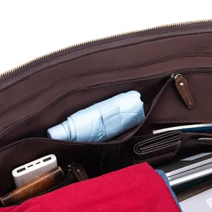 Detailed interior view showcasing multi-functional storage compartments of the leather travel bag.
