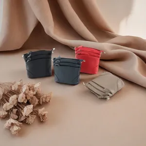Detailed view of genuine leather multi-zipper cross-body shoulder bags in various colors.