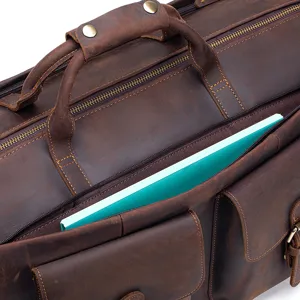 Close-up detail view of dark brown leather travel bag, durable hardware and smooth zipper.