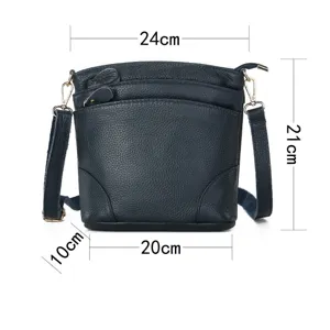 Detail view of dark blue genuine leather shoulder bag displaying exact dimensions and pockets.