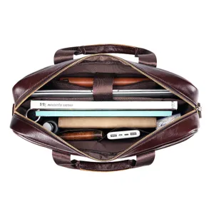 Detailed view of brown leather men's briefcase interior with laptop compartment and pockets.