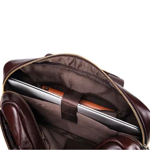 Interior detail shot of leather laptop briefcase showing spacious compartments and lining.