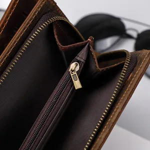 Leather wallet interior detail view showcasing quality zipper coin pocket and slots.