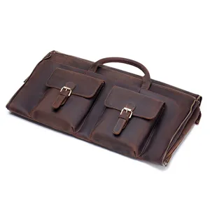 Brown leather garment bag detail, foldable suit travel storage and dry wet separation design.