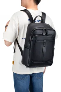 Detailed view of large capacity black genuine leather backpack for men, casual business.