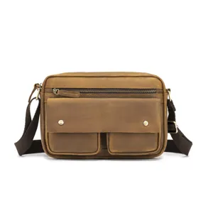 Detailed view of retro crazy horse leather men's crossbody bag with front pockets and zippers.
