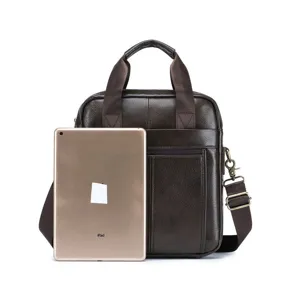 Detail shot of a dark brown genuine leather men's shoulder bag with a size reference tablet.