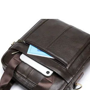 Close-up detail of brown leather men messenger bag with front zipper pocket and compartments.