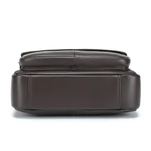 Dark brown genuine leather men bag bottom detail close up view, business commute style