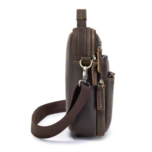Detail view of men vintage crazy horse leather shoulder bag side profile with multiple zippers.