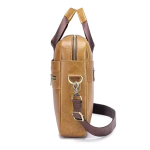 Detailed side view of brown leather business laptop bag with adjustable shoulder strap and metal hardware.