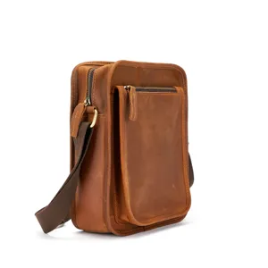 Brown leather vintage men vertical crossbody bag detail shot showing craftsmanship and zipper pocket.