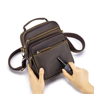 Detailed close-up of scratch-resistant crazy horse leather mens crossbody bag texture and hardware.
