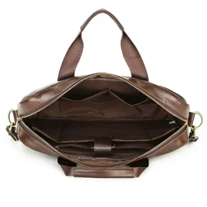 Interior detail of brown leather business briefcase laptop bag with multiple compartments.
