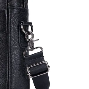 Black leather men's shoulder bag detail shot, genuine cowhide briefcase hardware close-up