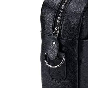 Detailed view of black genuine leather men's shoulder bag zipper and metal hardware.