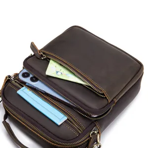 Vintage genuine leather messenger bag detail, multi-pocket casual cowhide shoulder bag.