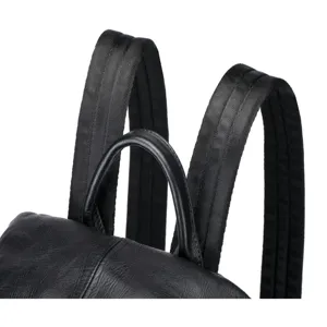 Genuine leather backpack detail view showing durable straps and handle craftsmanship.