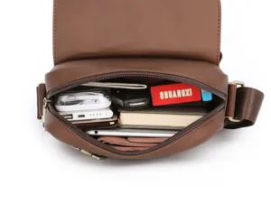 Genuine leather messenger bag interior detail showing large capacity and multi-pocket storage.