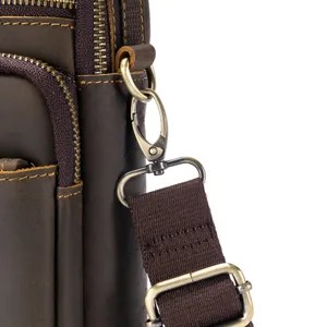 Genuine leather retro messenger bag hardware and durable adjustable strap detail close up