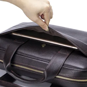 Detailed view of the dark brown genuine leather business briefcase front magnetic pocket.