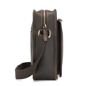 Detailed side view of vintage men's genuine leather vertical crossbody shoulder bag.