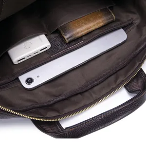Detailed interior view of leather business briefcase with multiple storage compartments.